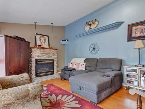 3400 Pleasant Valley Road, Vernon, BC - Indoor Photo Showing Living Room With Fireplace