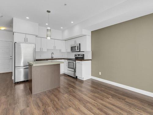 210-975 Academy Way, Kelowna, BC - Indoor Photo Showing Kitchen With Upgraded Kitchen