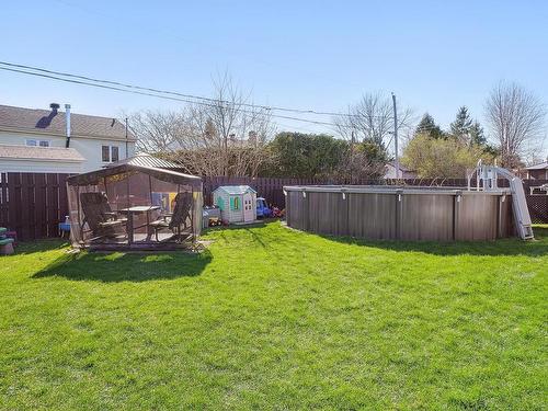 Cour - 24 Rue Ménard, Saint-Basile-Le-Grand, QC - Outdoor With Above Ground Pool With Backyard