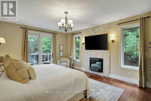 209 Hume Road, Puslinch, ON - Indoor Photo Showing Bedroom With Fireplace
