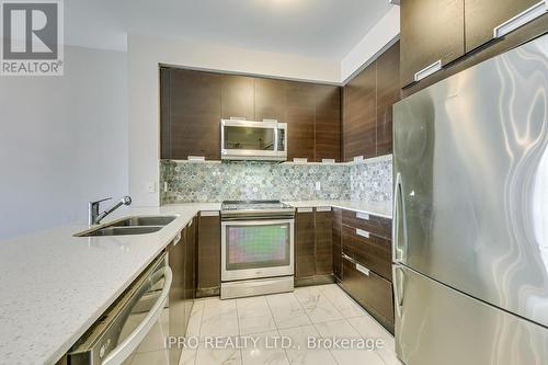 106 - 75 Eglinton Avenue W, Mississauga, ON - Indoor Photo Showing Kitchen With Stainless Steel Kitchen With Double Sink With Upgraded Kitchen