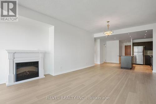 405 - 37 Ellen Street, Barrie, ON - Indoor Photo Showing Living Room With Fireplace