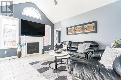 43 Cameron St, Springwater, ON - Indoor Photo Showing Living Room With Fireplace