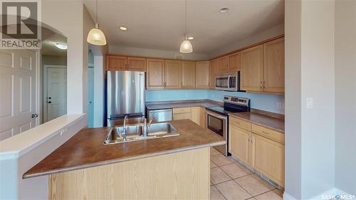 4279 Nicurity Drive, Regina, SK - Indoor Photo Showing Kitchen With Stainless Steel Kitchen With Double Sink