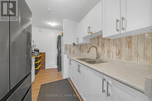 18 - 73 Driftwood Avenue, Toronto, ON - Indoor Photo Showing Kitchen With Double Sink