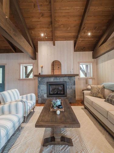 23 Birchgrove Bend, Kaslo, BC - Indoor Photo Showing Living Room With Fireplace