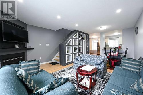 22 - 4950 Rathkeale Road, Mississauga, ON - Indoor Photo Showing Living Room With Fireplace