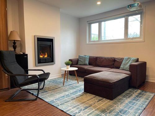 Basement - 5775 Rue Louis-Veuillot, Montréal (Mercier/Hochelaga-Maisonneuve), QC - Indoor Photo Showing Living Room With Fireplace