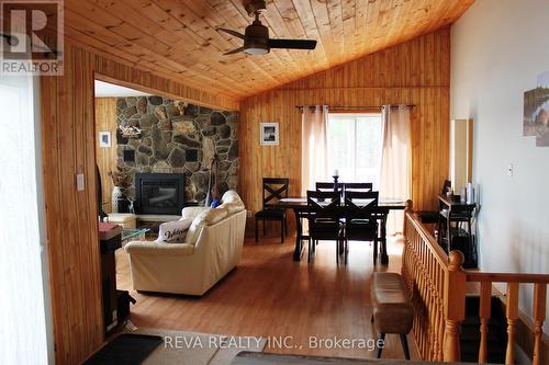 1724 Lewis Road, Highlands East, ON - Indoor With Fireplace