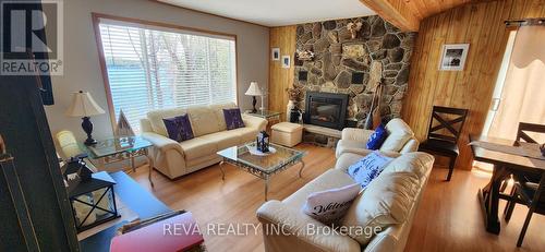 1724 Lewis Road, Highlands East, ON - Indoor Photo Showing Living Room With Fireplace