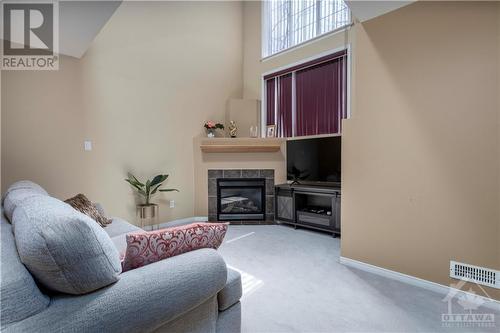 125 Gatestone Private, Ottawa, ON - Indoor Photo Showing Living Room With Fireplace