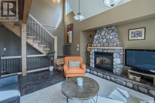 49 Mccrimmon Crescent, Blackstrap Shields, SK - Indoor Photo Showing Living Room With Fireplace