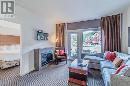 400 Stemwinder Drive Unit# 208, Kimberley, BC - Indoor Photo Showing Living Room With Fireplace