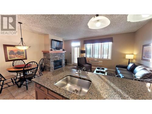 400 Bighorn Boulevard Unit# 415 N, Radium Hot Springs, BC - Indoor Photo Showing Other Room With Fireplace