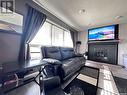 488 Willow Bay, Estevan, SK  - Indoor Photo Showing Living Room With Fireplace 