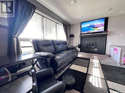 488 Willow Bay, Estevan, SK - Indoor Photo Showing Living Room With Fireplace