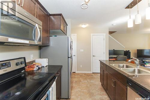 501 3440 Avonhurst Drive, Regina, SK - Indoor Photo Showing Kitchen With Double Sink