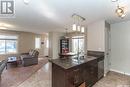501 3440 Avonhurst Drive, Regina, SK  - Indoor Photo Showing Kitchen With Double Sink 