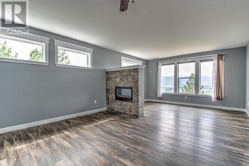 7464 Mclennan Road, Vernon, BC - Indoor Photo Showing Living Room With Fireplace