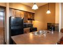 409 - 1545 Kicking Horse Trail, Golden, BC  - Indoor Photo Showing Kitchen With Double Sink 