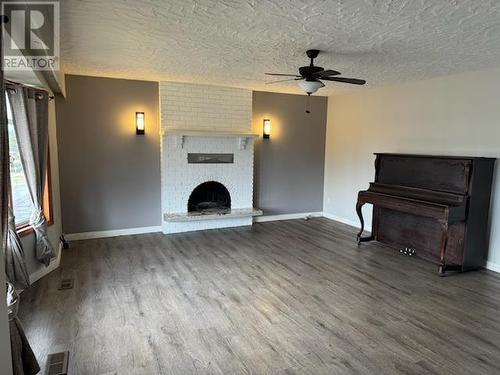 27 Mcintyre Drive, Mackenzie, BC - Indoor With Fireplace