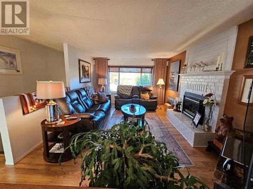 5111A 43 Street Ne, Chetwynd, BC - Indoor Photo Showing Living Room With Fireplace