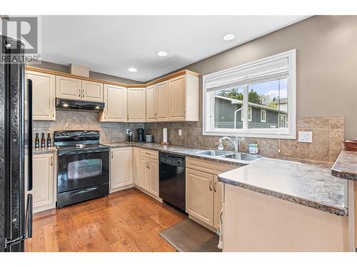 6744 Longacre Drive Unit# B, Vernon, BC - Indoor Photo Showing Kitchen With Double Sink