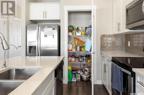 3354 Green Poppy Street, Regina, SK - Indoor Photo Showing Kitchen With Double Sink