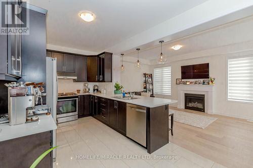 3 Ringway Road, Brampton, ON - Indoor Photo Showing Kitchen With Fireplace With Double Sink
