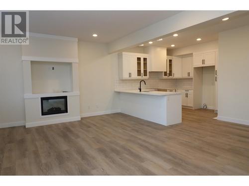 706 4274 22Nd Avenue, Prince George, BC - Indoor Photo Showing Kitchen With Fireplace