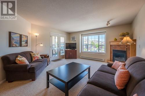 850 Railway Lane Unit# 201, Okanagan Falls, BC - Indoor Photo Showing Living Room With Fireplace