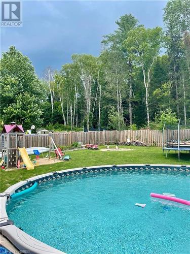 4 Johnston Drive, South River, ON - Outdoor With Above Ground Pool