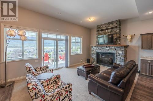 2450 Radio Tower Road Unit# 180, Oliver, BC - Indoor Photo Showing Living Room With Fireplace