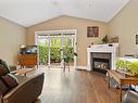 21-3110 Cook St, Chemainus, BC  - Indoor Photo Showing Living Room With Fireplace 