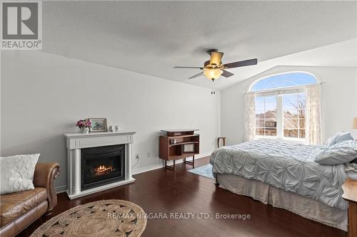 62 Rolling Meadows Boulevard, Pelham, ON - Indoor Photo Showing Bedroom With Fireplace