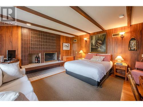 350 Eastside Road, Okanagan Falls, BC - Indoor Photo Showing Bedroom With Fireplace