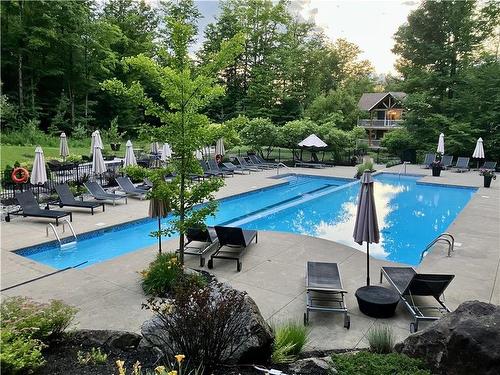 Pool - 301-240 Rue Du Cercle-Des-Cantons, Bromont, QC - Outdoor With In Ground Pool With Backyard