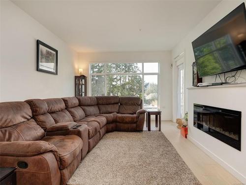 208-7162 West Saanich Rd, Central Saanich, BC - Indoor Photo Showing Living Room With Fireplace