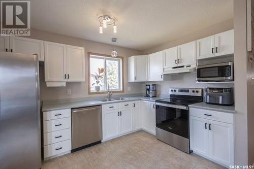 3105 5Th Avenue E, Prince Albert, SK - Indoor Photo Showing Kitchen With Double Sink