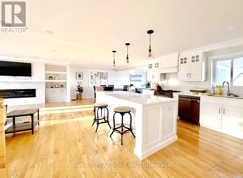 5173 Rice Lake Drive N, Hamilton Township (Bewdley), ON - Indoor Photo Showing Kitchen With Fireplace With Stainless Steel Kitchen With Upgraded Kitchen