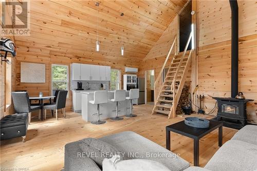 1814 Riding Ranch Road, South River, ON - Indoor Photo Showing Living Room With Fireplace