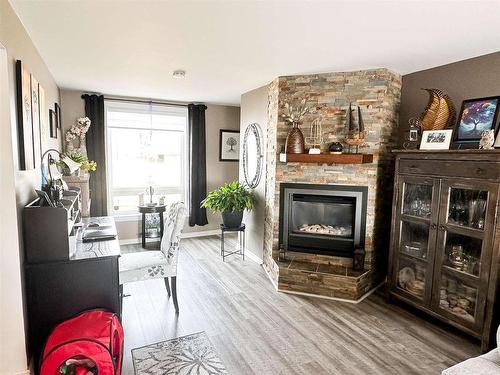 18 Goldshore Road, Red Lake, ON - Indoor Photo Showing Living Room With Fireplace