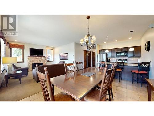 600 Bighorn Boulevard Unit# 616 D, Radium Hot Springs, BC - Indoor Photo Showing Dining Room With Fireplace