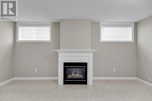 55 - 588 Thistlewood Drive E, London, ON - Indoor With Fireplace