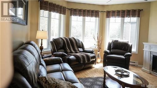 12 Macintosh Crescent, Linton Corner, NB - Indoor Photo Showing Living Room With Fireplace