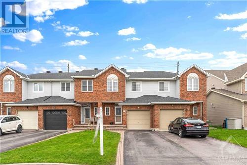 Beautifully renovated townhome with 2 car driveway - 977 Markwick Crescent, Ottawa, ON - Outdoor With Facade