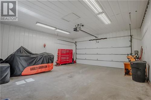 Garage walls covered in white tin, brightens the space and makes it very functional for many uses. - 20268 Beaupre Road, Green Valley, ON - Indoor Photo Showing Garage