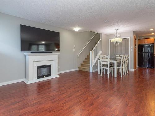 209-2685 Deville Rd, Langford, BC - Indoor Photo Showing Living Room With Fireplace
