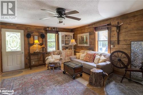 1429 Tamarack Lake Road, Highlands East, ON - Indoor Photo Showing Living Room With Fireplace