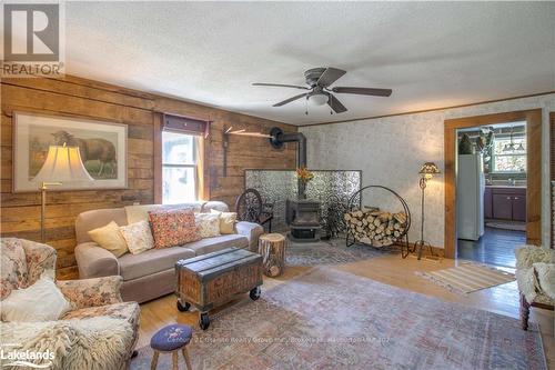 1429 Tamarack Lake Road, Highlands East, ON - Indoor Photo Showing Living Room With Fireplace